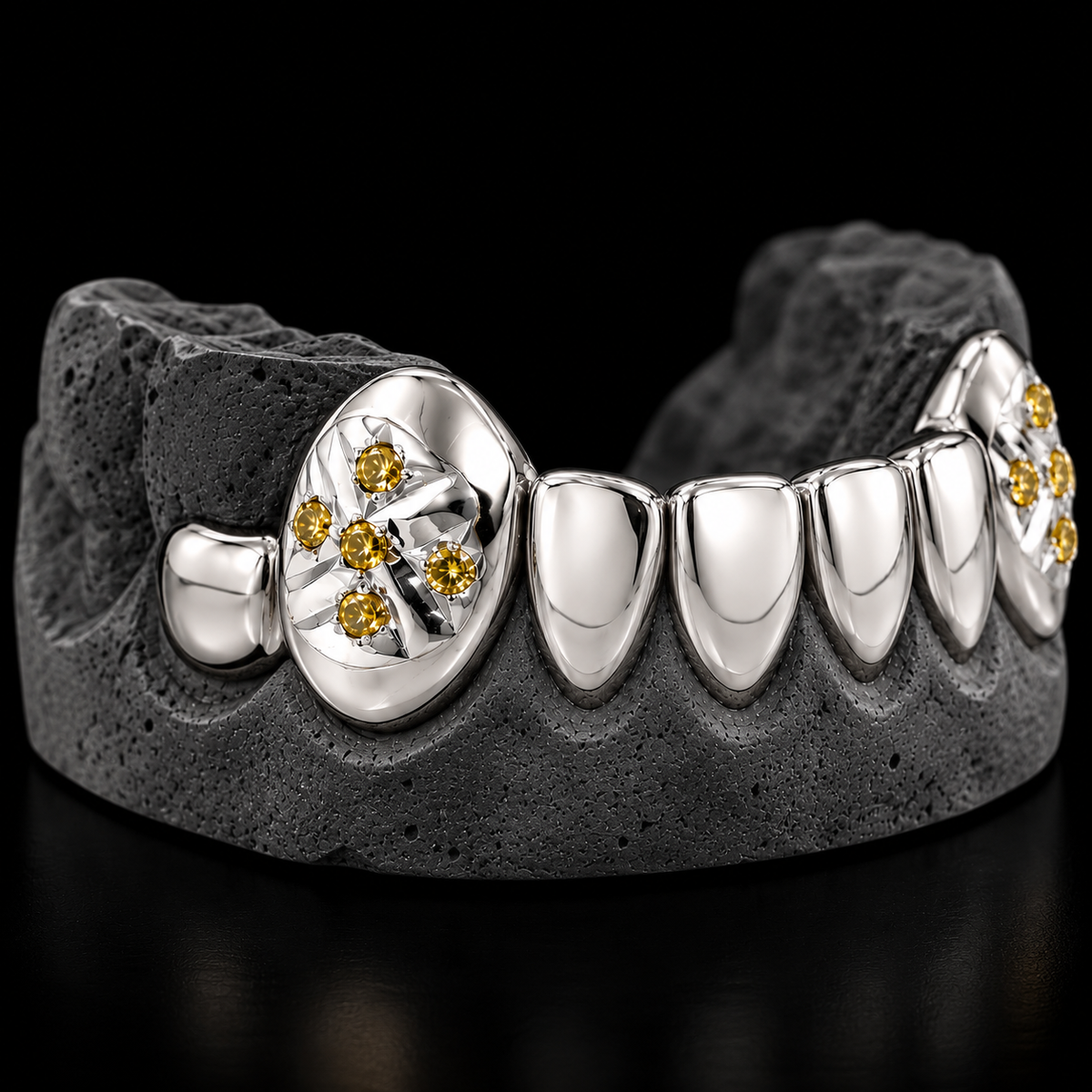 Close-up of 2 Gold Fang Teeth With Diamonds, detailed facet work and gemstone setting