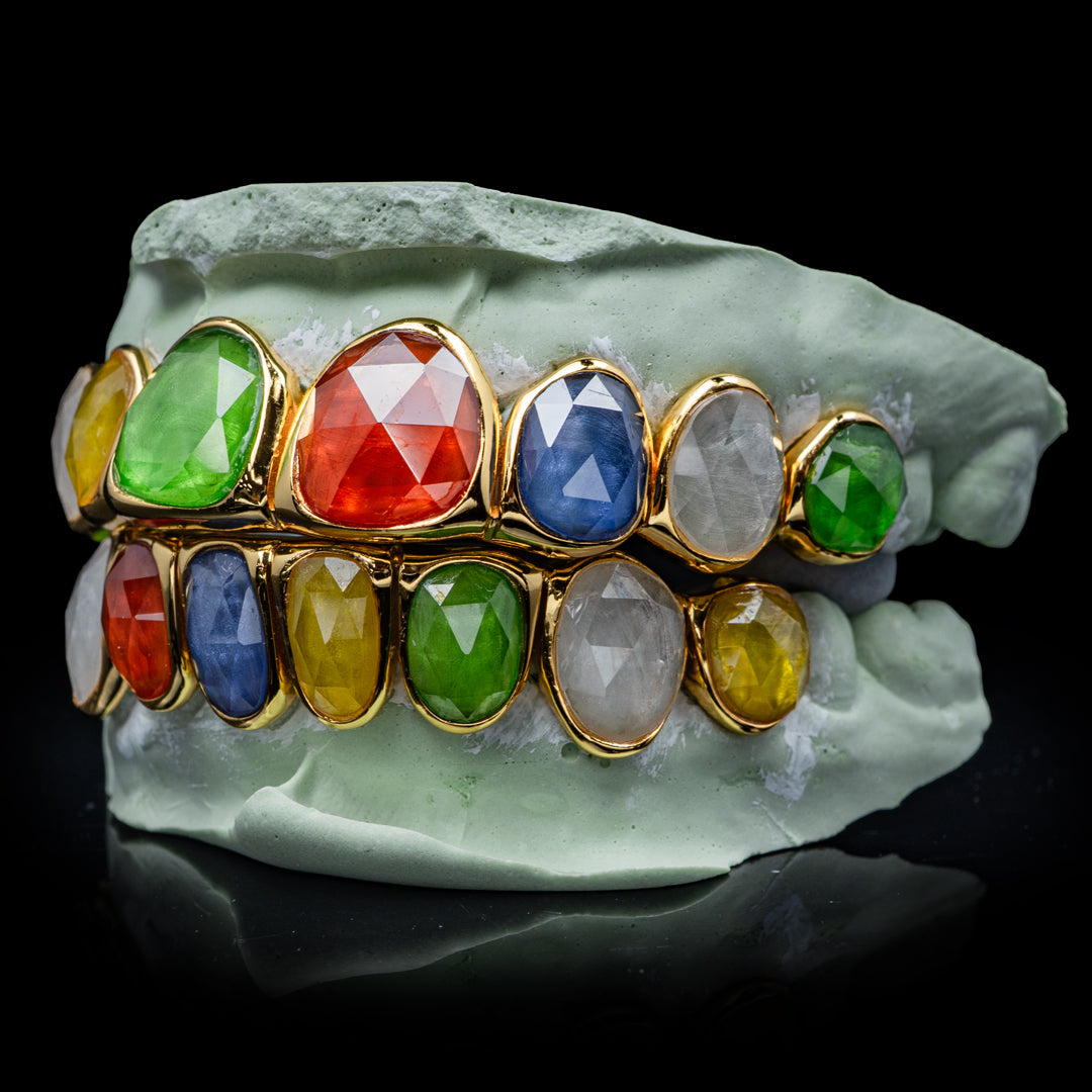 Elegant multi-facet gemstone grillz featuring polished edges and vibrant gemstone
