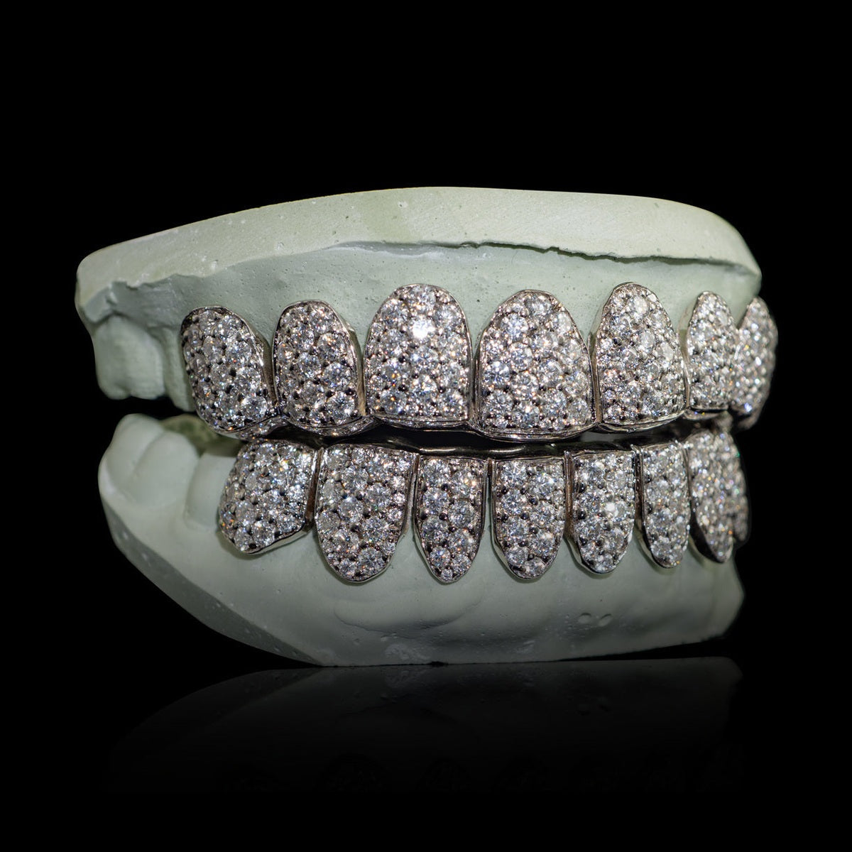 Silver-tone 2mm VVS moissanite grillz showing depth of honeycomb zigzag pattern and full arch coverage