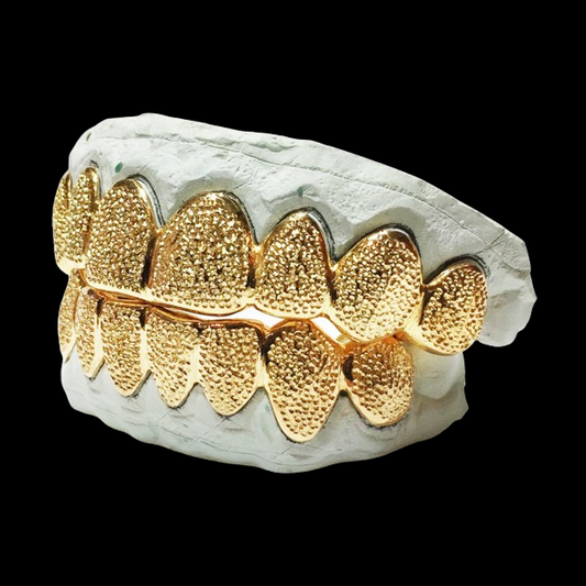Side view of 8-tooth 18K yellow gold plated diamond dust grillz