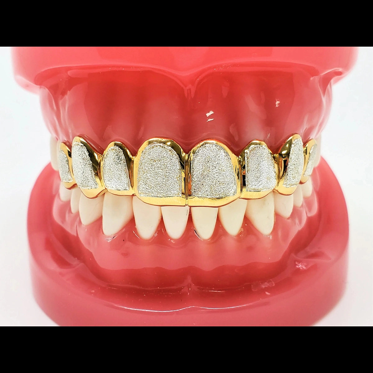 Full upper two-tone grillz set with 10 diamond dust cut teeth and yellow gold borders