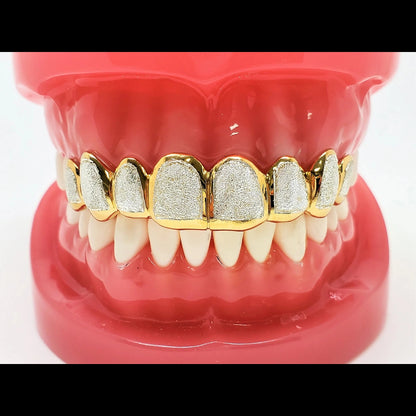 Full upper two-tone grillz set with 10 diamond dust cut teeth and yellow gold borders