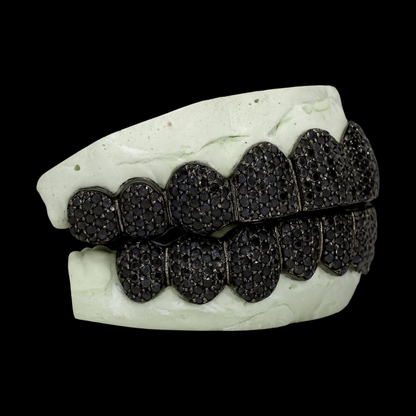 Top-down view of black diamond grillz highlighting symmetrical high-density pave layout and seamless dental arch integration