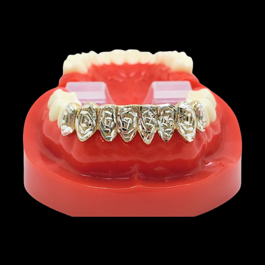Geometric cutout gold grillz for six upper teeth on red dental model