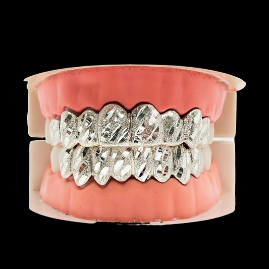 Separate upper and lower custom silver nugget cut grillz on split dental model