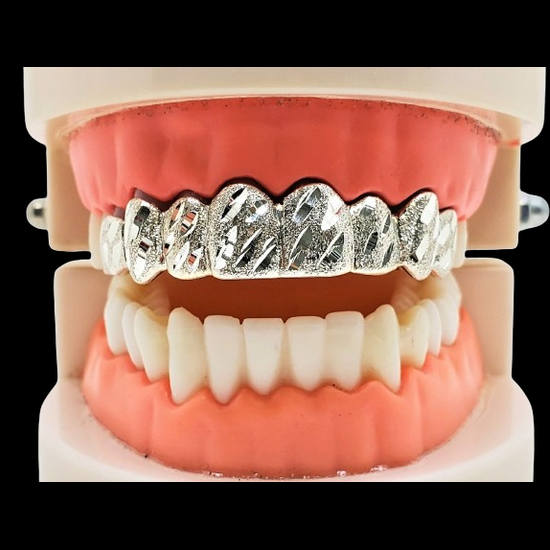 Upper teeth custom silver nugget cut grillz displayed on dental model