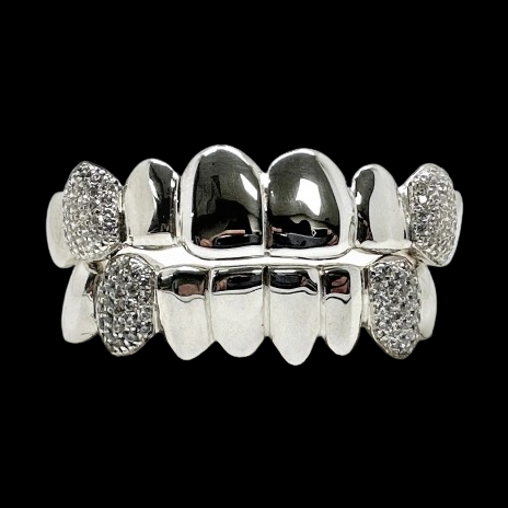 Silver honeycomb moissanite fang grillz set against black background