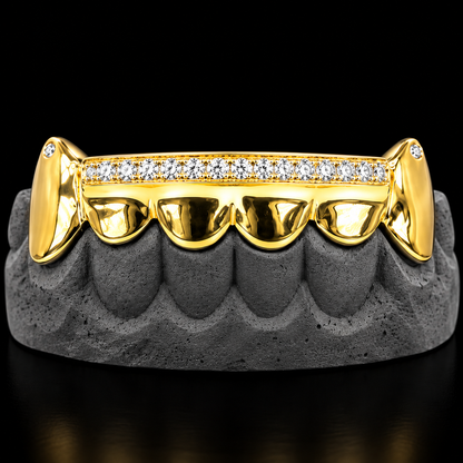 Front view of gold upper grillz featuring paved round diamonds and fang tips