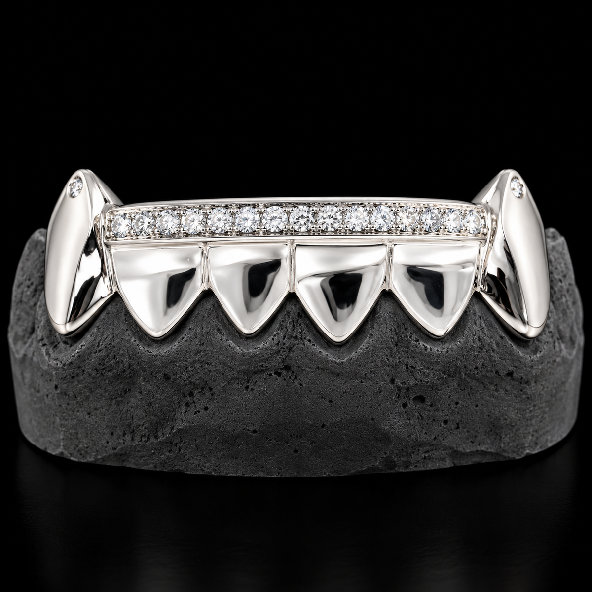 Silver upper grillz with sharp pointed teeth and continuous diamond row