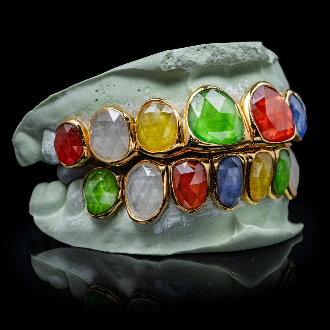 High-quality multi-facet gemstone grillz with reflective facets and precise fit