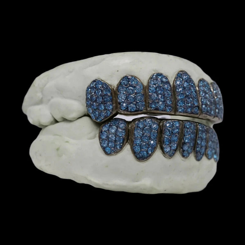 Ice blue VVS moissanite diamond grillz with round-cut stones in dark metal on dental mold