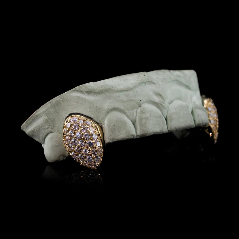 10K gold top fang grillz with dense pavé Moissanite diamonds on dental mold