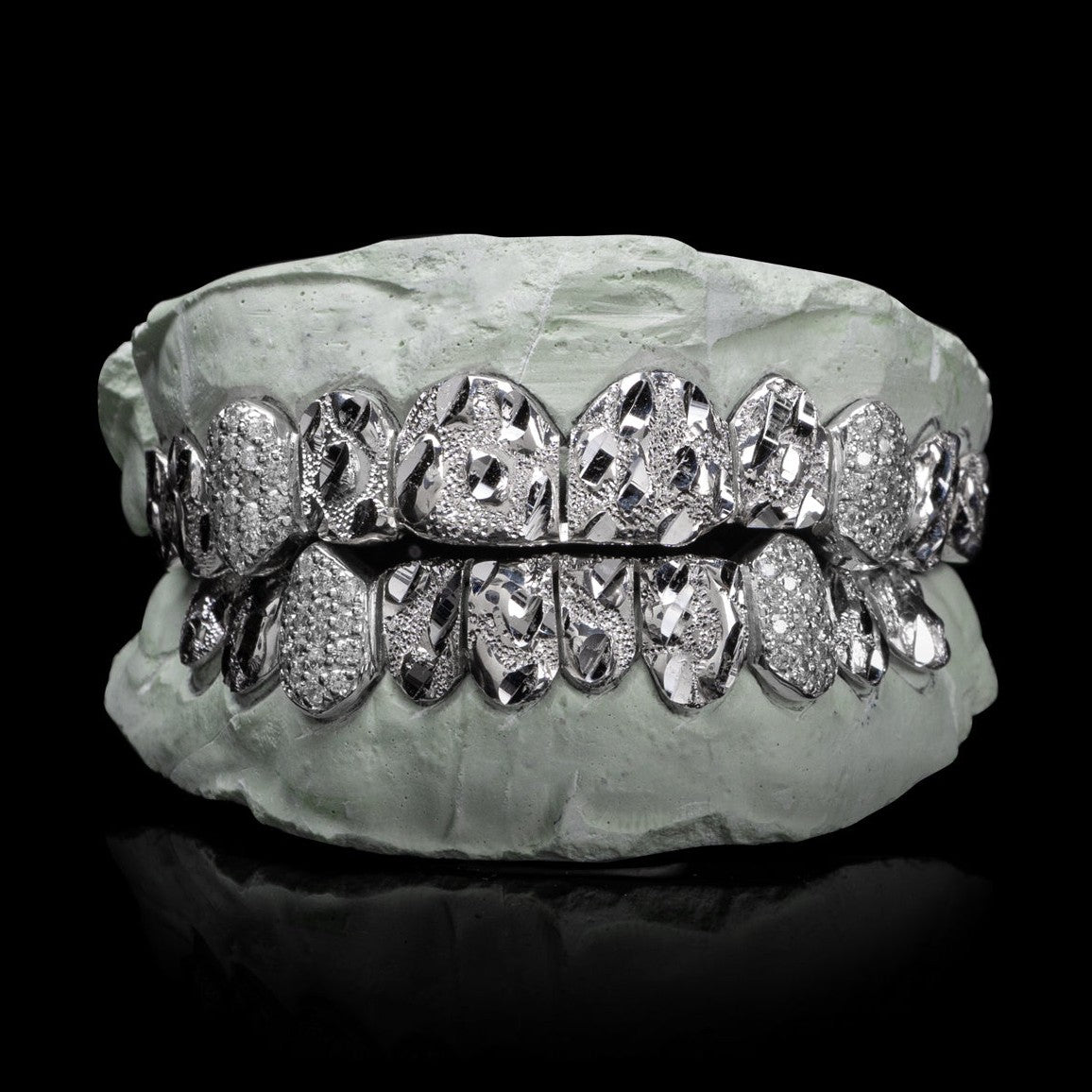 Sterling silver Nugget Cut grillz with VVS moissanites on dental mold