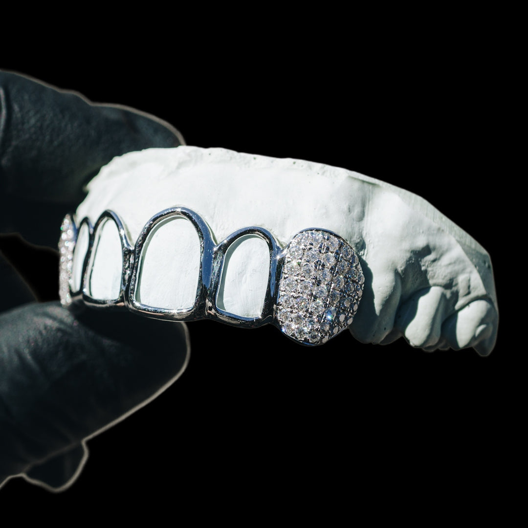 Open face silver grillz with iced moissanite fangs and pave set stones