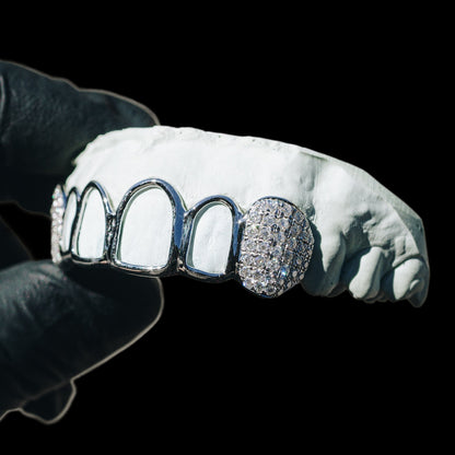Open face silver grillz with iced moissanite fangs and pave set stones