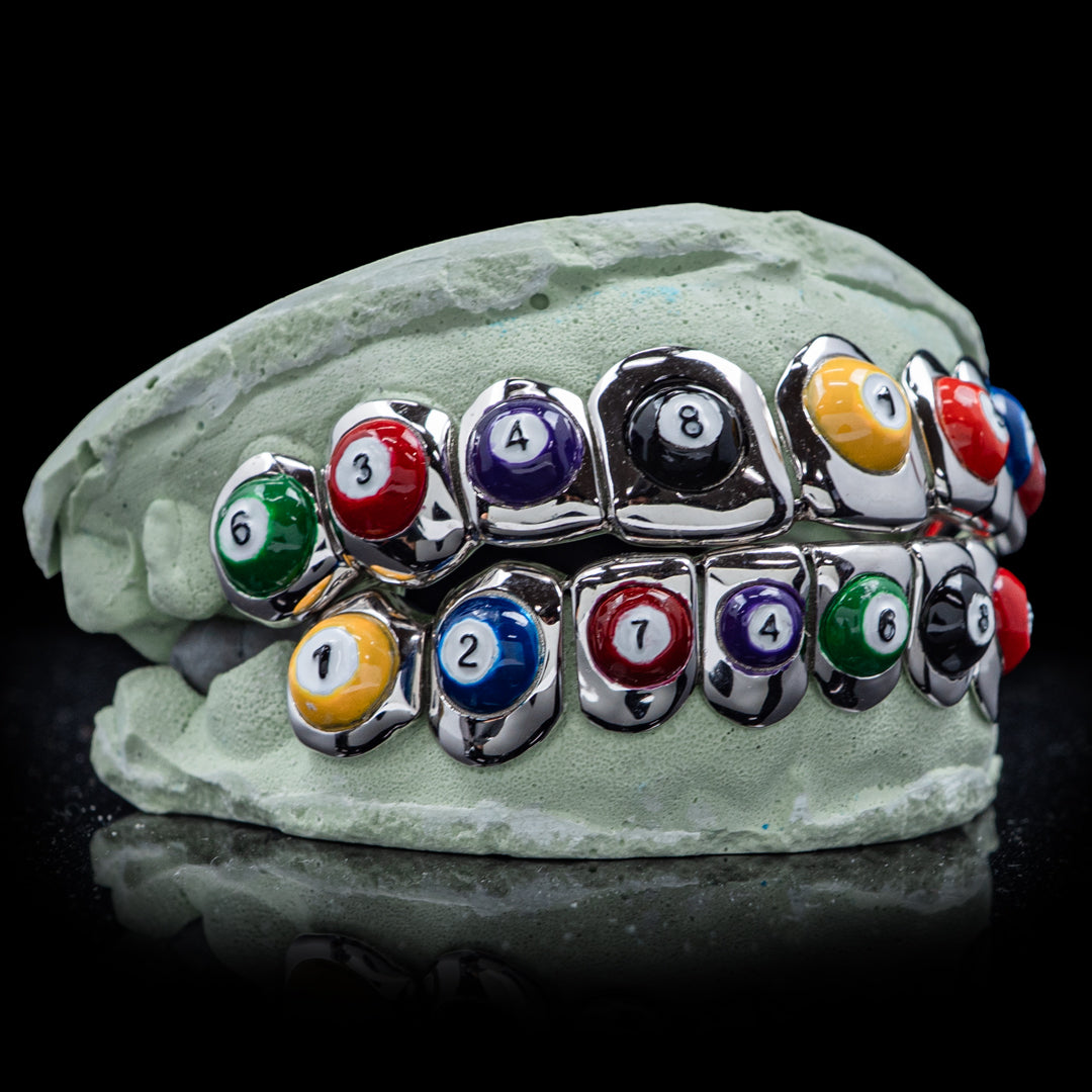 8-Ball Pool Grillz – premium black enamel grillz featuring a bold 8-ball pattern for a confident, polished appearance.