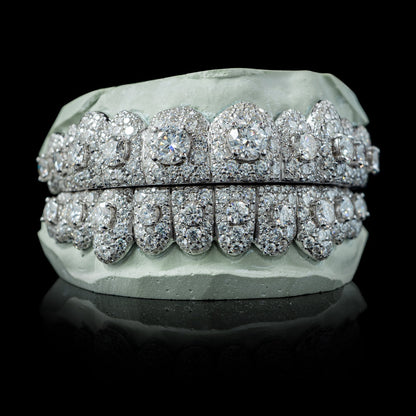 Full coverage white metal iced moissanite grillz showing depth and brilliant cut stones