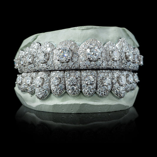 Full coverage white metal iced moissanite grillz showing depth and brilliant cut stones