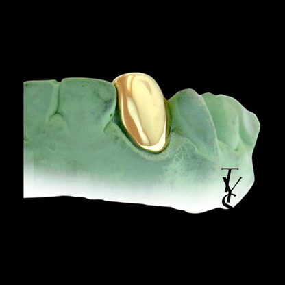 Yellow gold single tooth grillz in green mold with TY logo