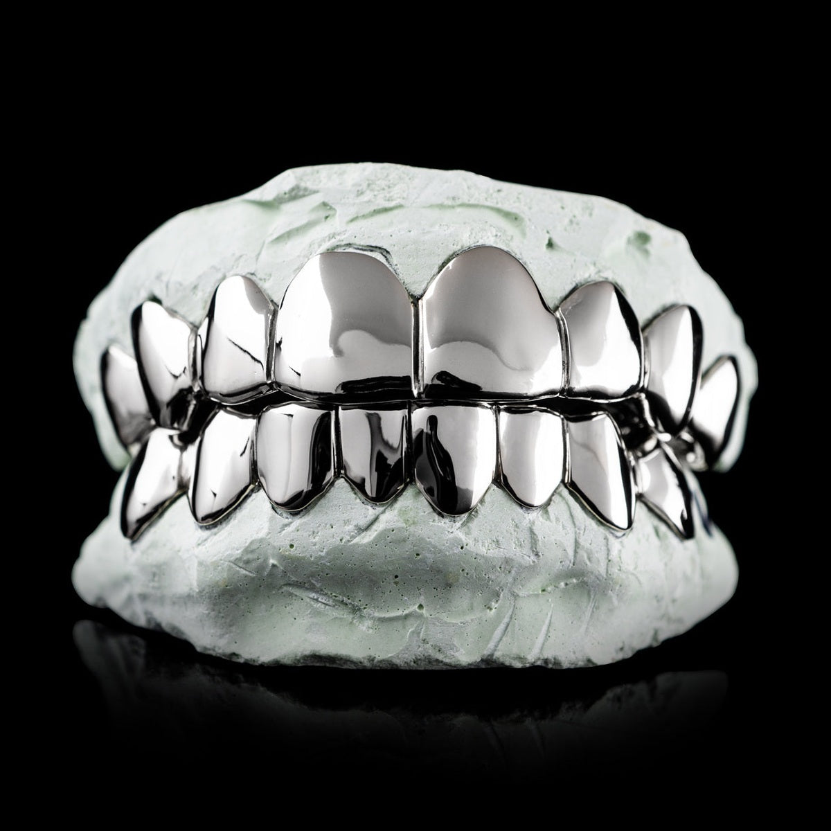 Sterling silver deep cut diamond grillz on dental mold