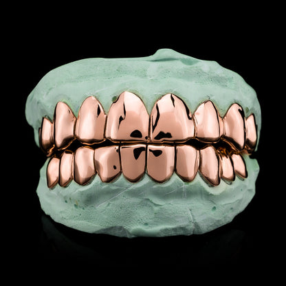 Rose gold plated deep cut silver grillz on dental mold