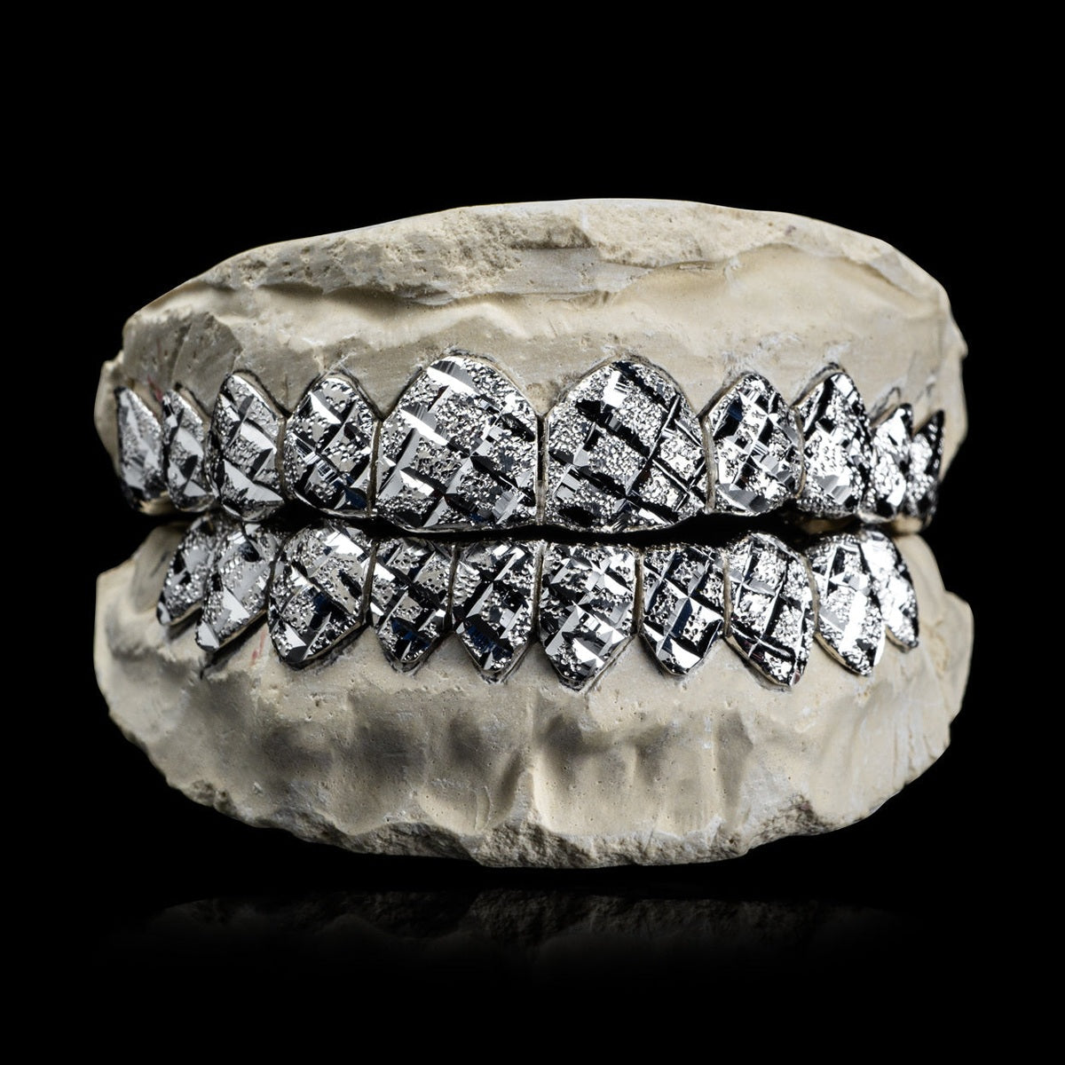 Solid .925 Sterling Silver diamond cut grillz with diamond dust finish on dental mold