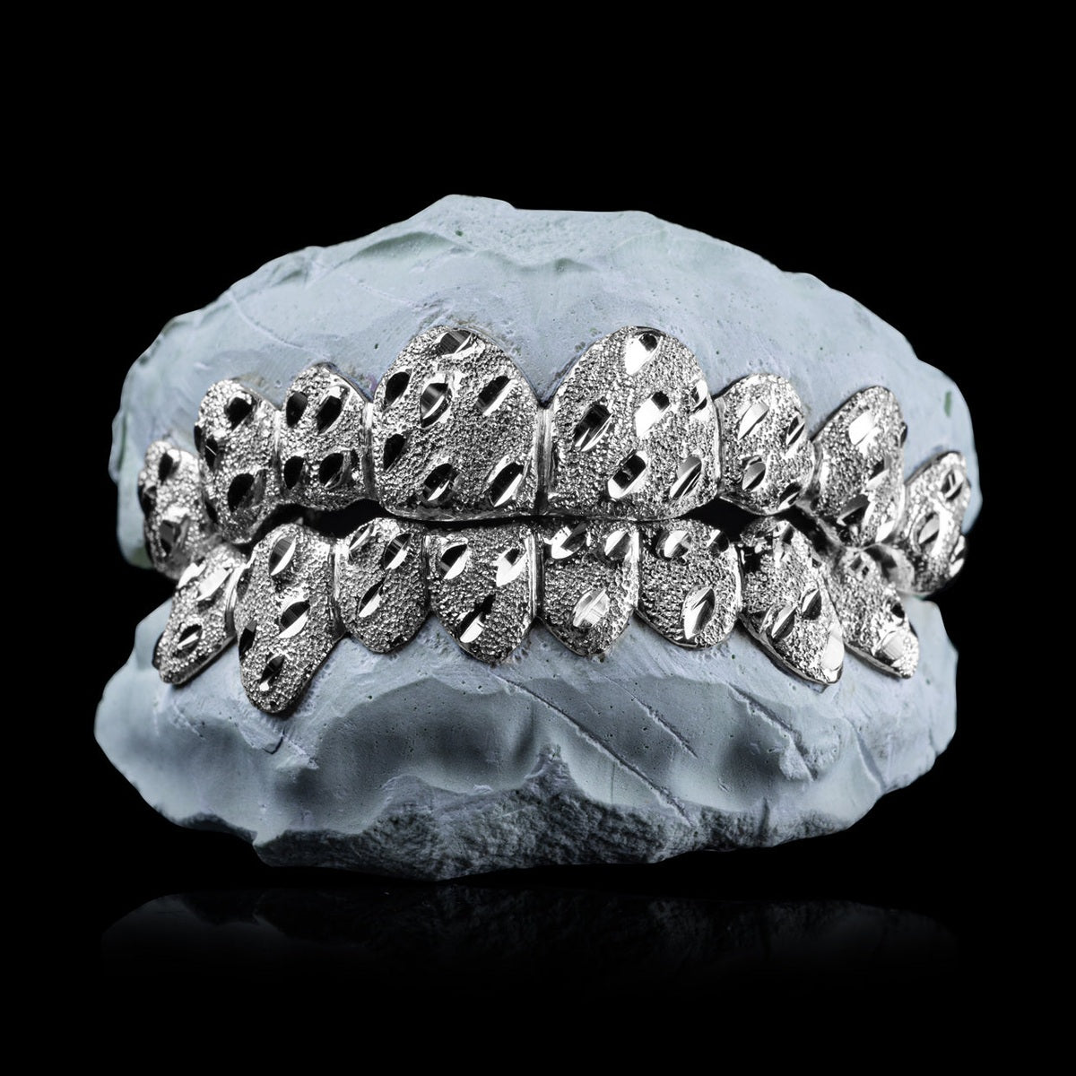Solid .925 Sterling Silver Nugget Cut Grillz with diamond dust texture on dental mold