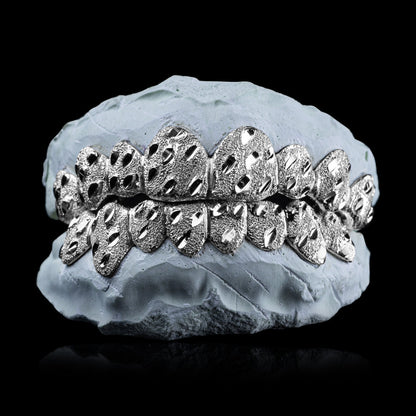 Solid .925 Sterling Silver Nugget Cut Grillz with diamond dust texture on dental mold