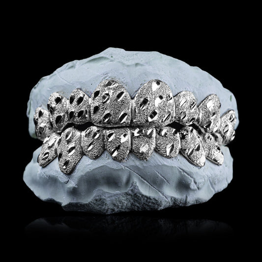 Solid .925 Sterling Silver Nugget Cut Grillz with diamond dust texture on dental mold
