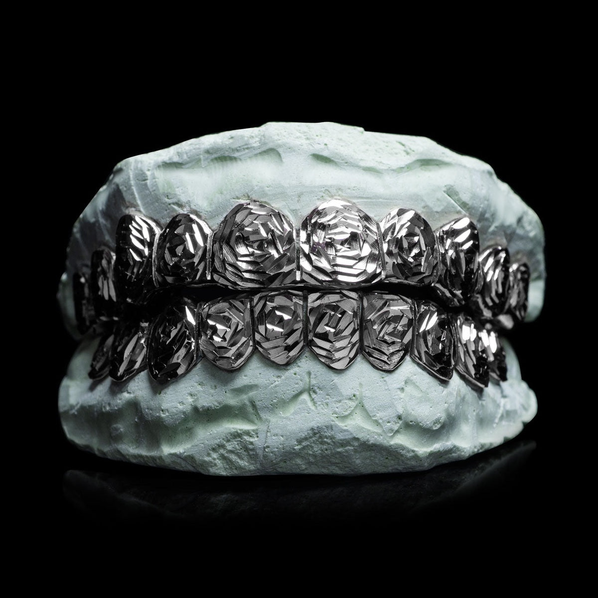 Polished sterling silver rose cut grillz with diamond facets
