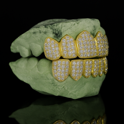 Gold-toned 6-on-6 iced out moissanite teeth jewelry three-quarter view