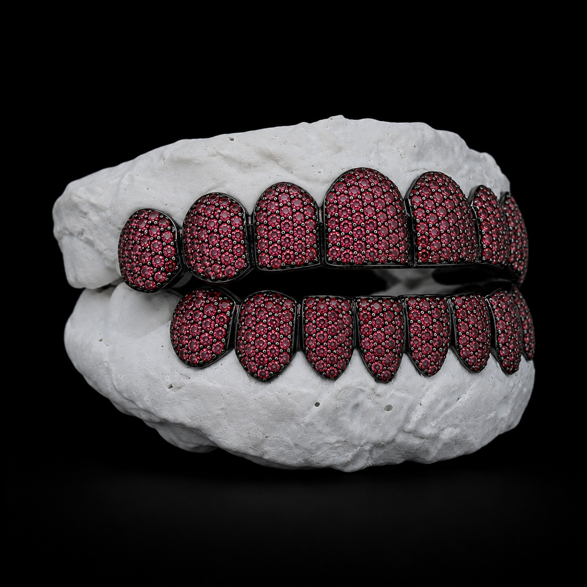 Side view black custom grillz with crimson moissanite stones and tapered cusps