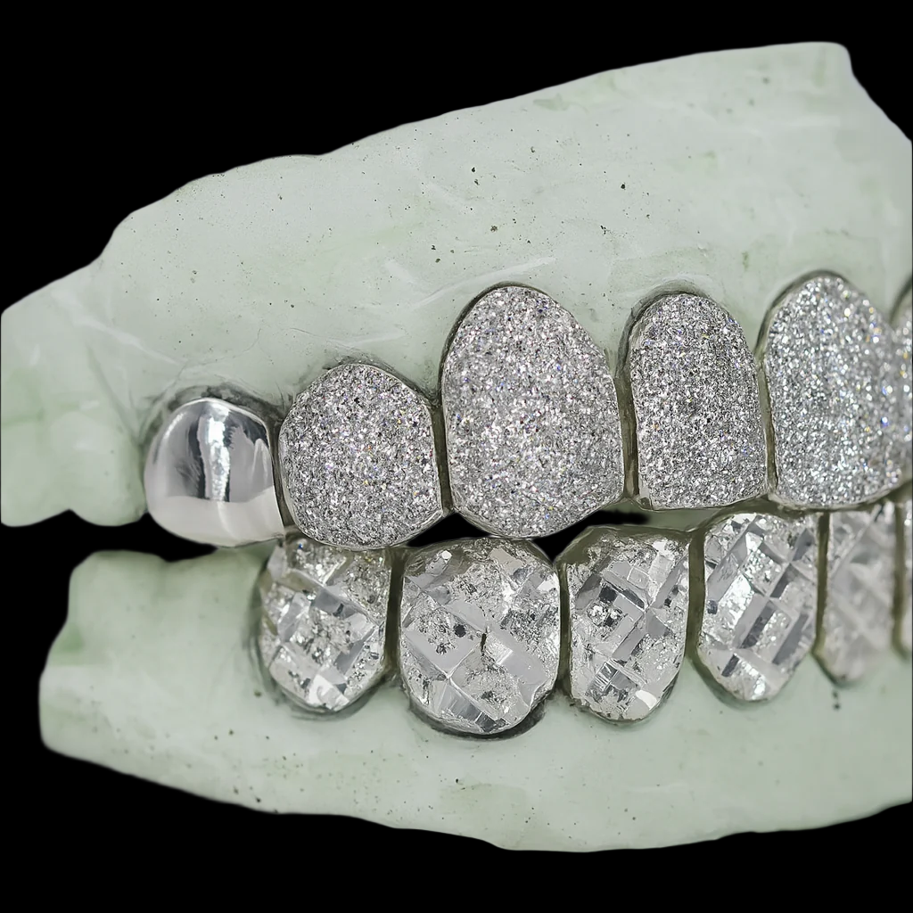 Close-up silver grillz with polished incisor and micro-pavé sparkle teeth