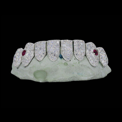 Close-up of custom VVS Moissanite Ruby Stone Fang Diamond Grillz showing symmetrical ruby accents on silver base