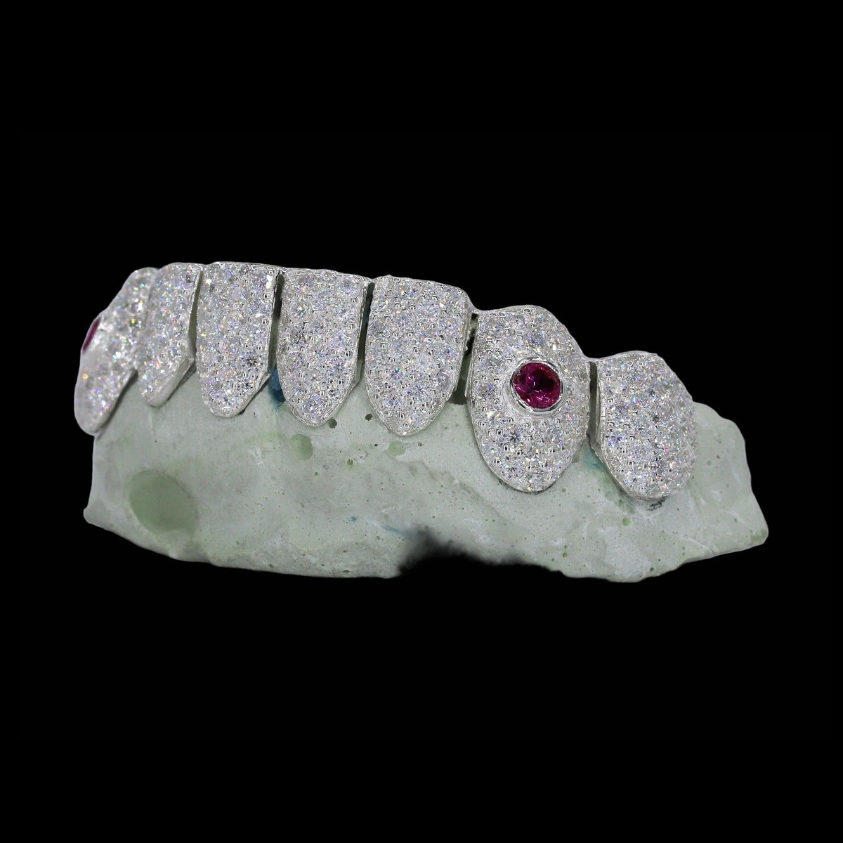 VVS Moissanite Ruby Stone Fang Diamond Grillz in silver with red ruby fangs and white diamond teeth