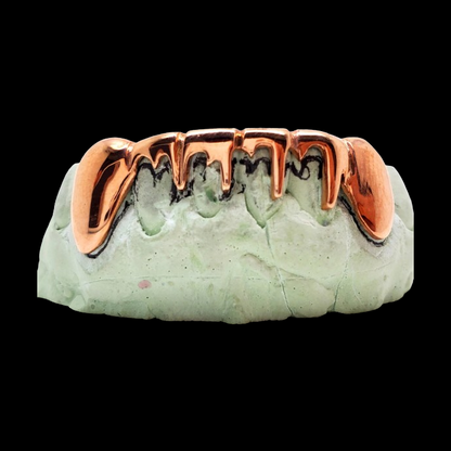 Front view of removable upper drip style sterling silver teeth jewelry