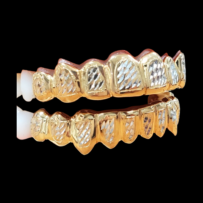 Two-tone diamond cut grillz set with 18K yellow gold plated sections and textured white teeth